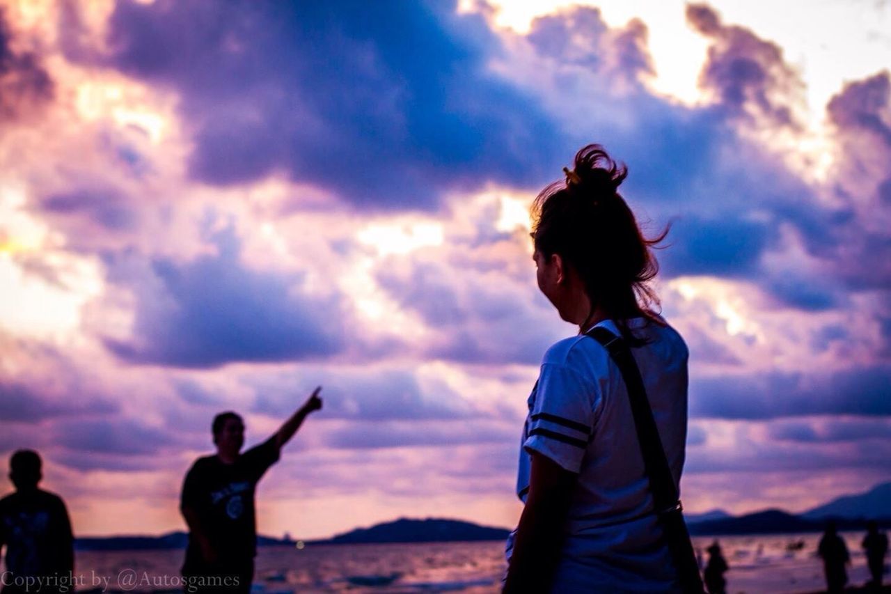 sky, lifestyles, cloud - sky, leisure activity, standing, sunset, cloudy, three quarter length, togetherness, waist up, men, rear view, silhouette, cloud, photographing, casual clothing, photography themes, person