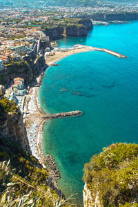 High angle view of sea and cityscape