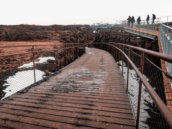 View of footbridge against clear sky