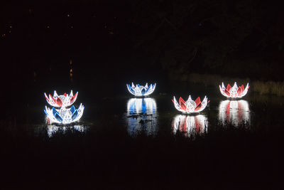 Close-up of illuminated lighting equipment at night