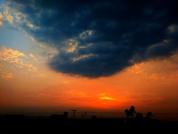 Scenic view of dramatic sky over sea during sunset