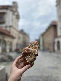 Cropped hand holding ice cream cone