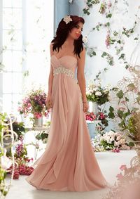 Beautiful woman wearing off shoulder evening gown while standing amidst flowers