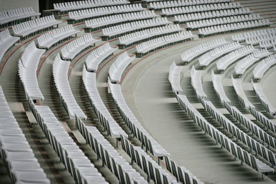 High angle view of empty chairs in stadium