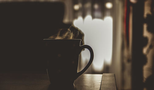 Close-up of coffee cup on table