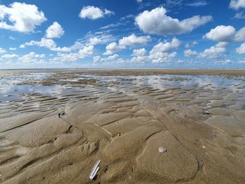 Scenic view of beach against sky