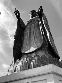 Low angle view of statue against sky