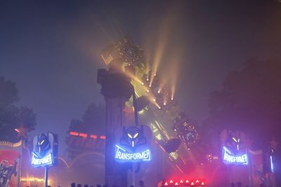 Low angle view of illuminated lights in city at night