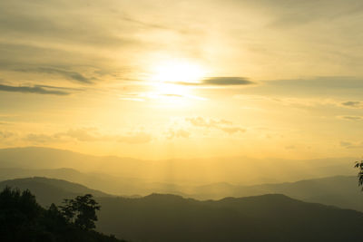 Scenic view of silhouette mountains against sky during sunset