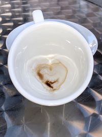 High angle view of cappuccino served on table