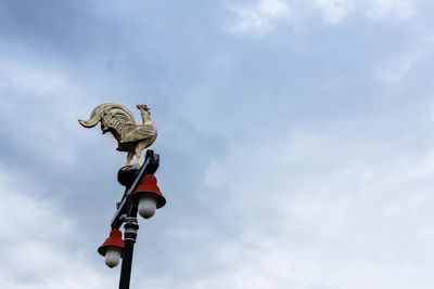 Low angle view of statue against sky