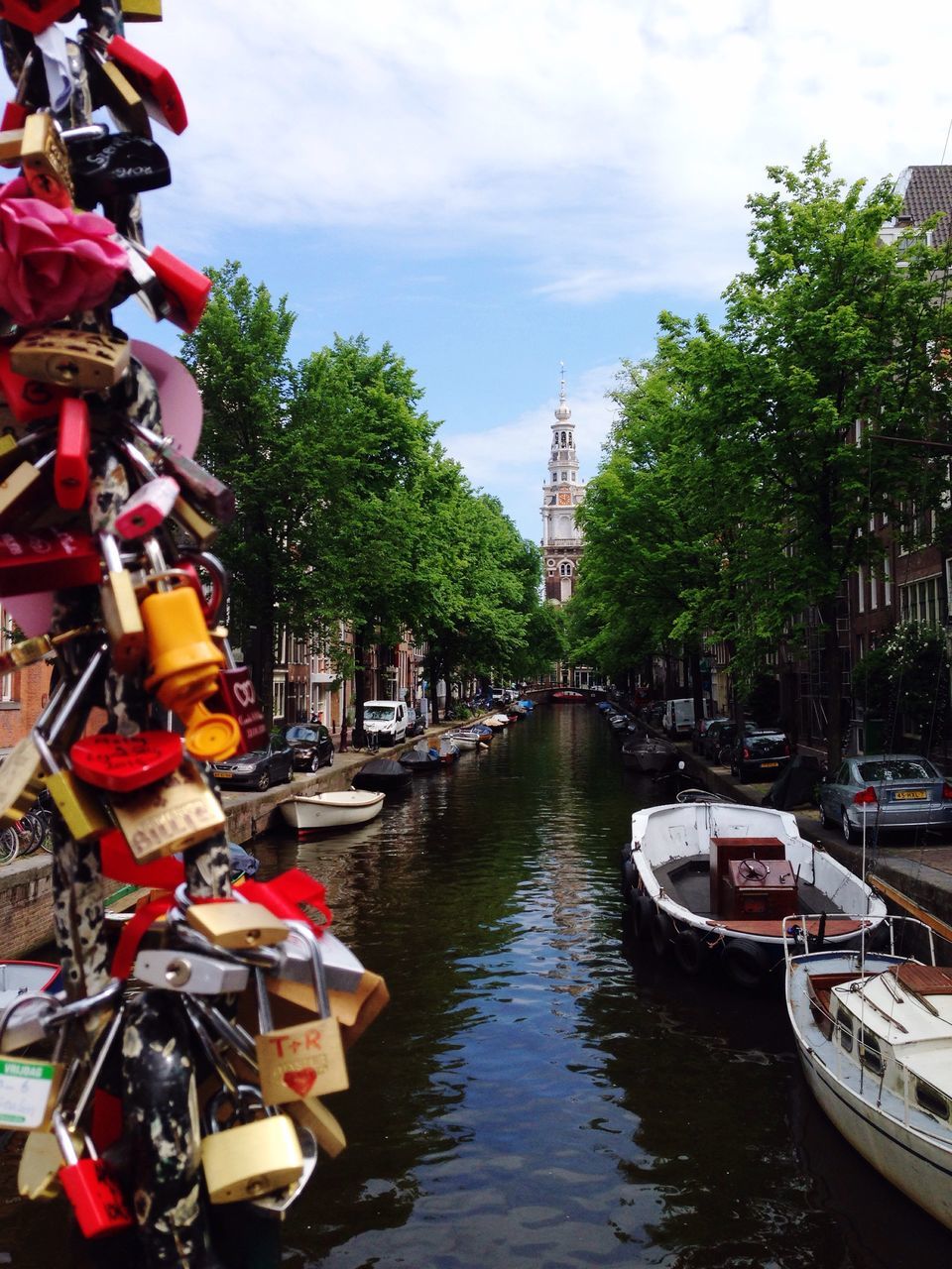 transportation, tree, architecture, water, built structure, building exterior, mode of transport, nautical vessel, canal, sky, waterfront, moored, boat, river, city, day, cloud - sky, in a row, incidental people, outdoors