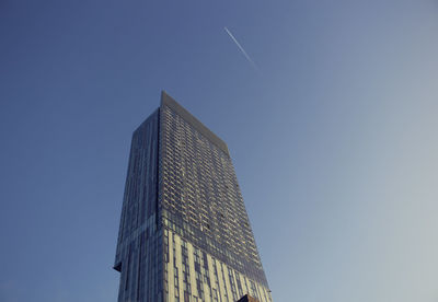 Low angle view of skyscraper against clear sky