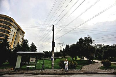 Silhouette of people against cloudy sky