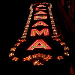 Low angle view of illuminated text at night