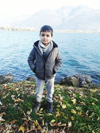 Portrait of boy standing in sea