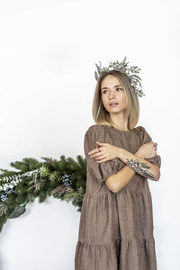 A young woman with blonde hair with a christmas tree. new year's concept,christmas decorations.