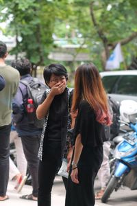 Rear view of women talking in park