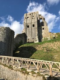 Low angle view of old ruin against sky