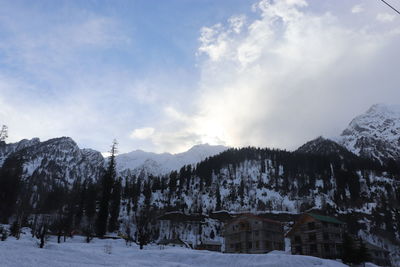 Scenic view of snowcapped mountains against sky