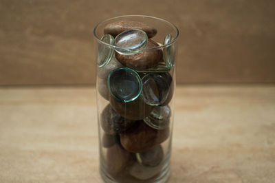 Close-up of drink in glass jar on table