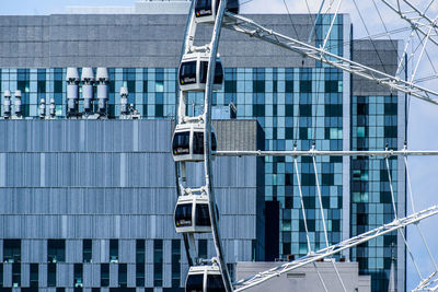 Low angle view of modern glass building in city