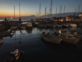 Boats moored at harbor