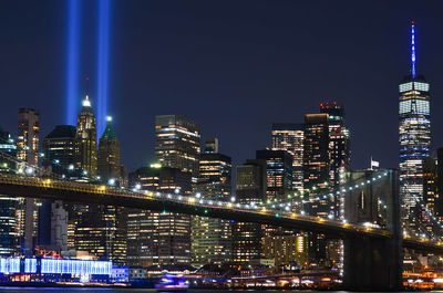 Illuminated buildings in city at night to show respect to 911. 