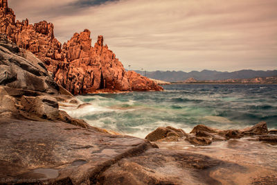 Scenic view of rock formation in sea