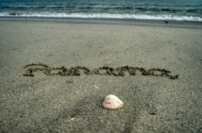 Text on sand at beach