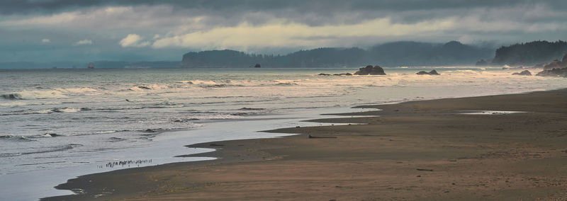 Scenic view of beach against sky