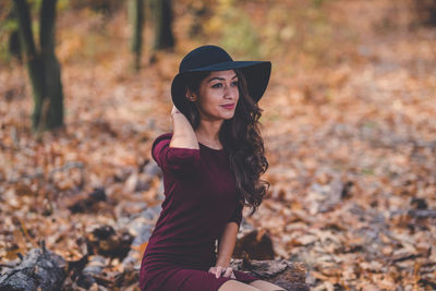 Portrait of young woman in hat