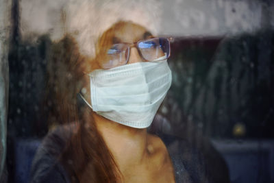 Portrait of woman wearing sunglasses outdoors