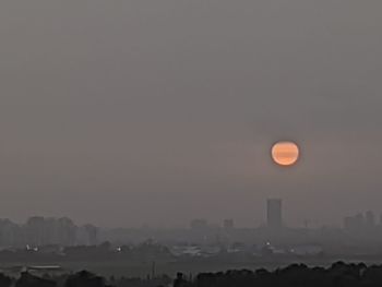 View of cityscape against sky during sunset