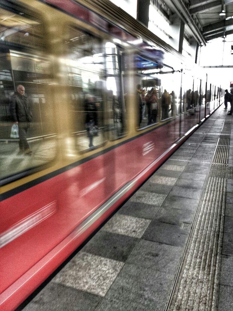 TRAIN ON RAILROAD STATION PLATFORM