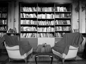 Rear view of man sitting on chair