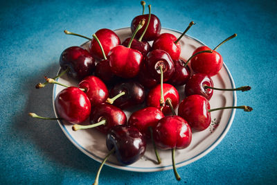High angle view of strawberries in bowl on table
