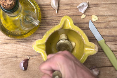 High angle view of person preparing food on cutting board
