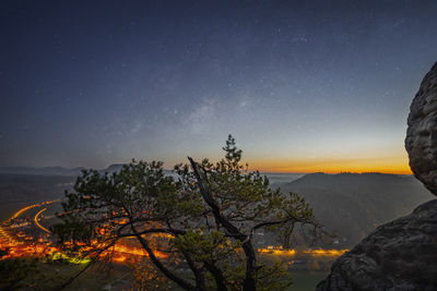 Scenic view of mountains against sky at night