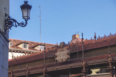 Low angle view of buildings against blue sky