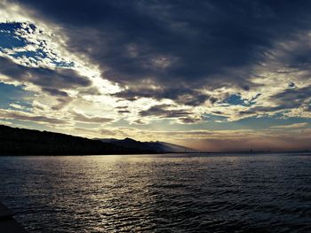 Scenic view of sea against cloudy sky