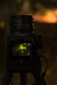 Close-up of camera on ground at night