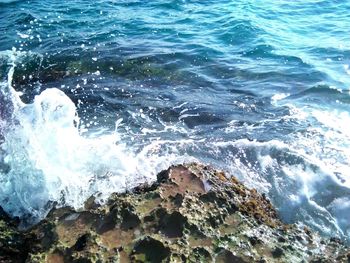 Waves splashing on rocks