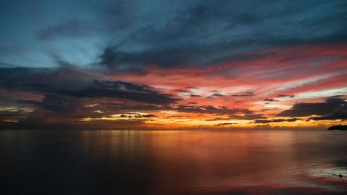 Scenic view of sea against romantic sky at sunset