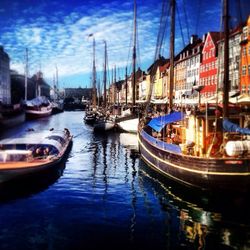 Boats moored at harbor