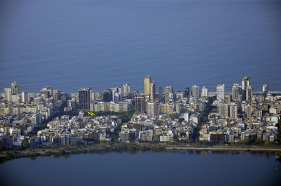 Aerial view of city amidst sea