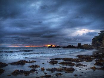 Scenic view of sea against cloudy sky