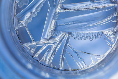 Close-up of snow against blue sky