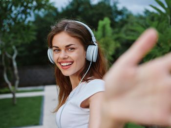 Portrait of young woman using mobile phone