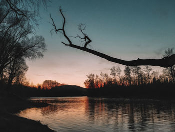 Scenic view of lake against sky during sunset